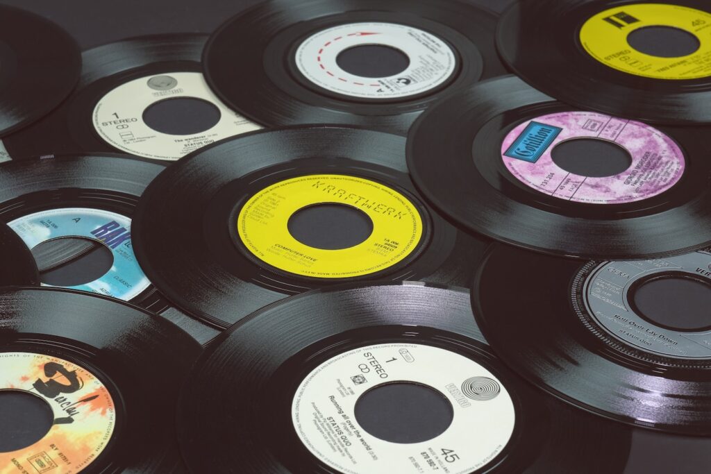 Vinyl records, 7 inch singles, 45 rpm.