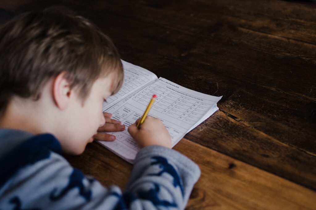 Child completing maths homework