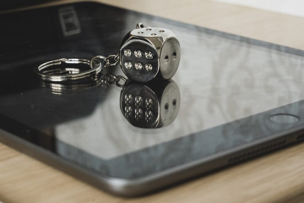 My lucky silver die keyring, reflected in my Ipad.